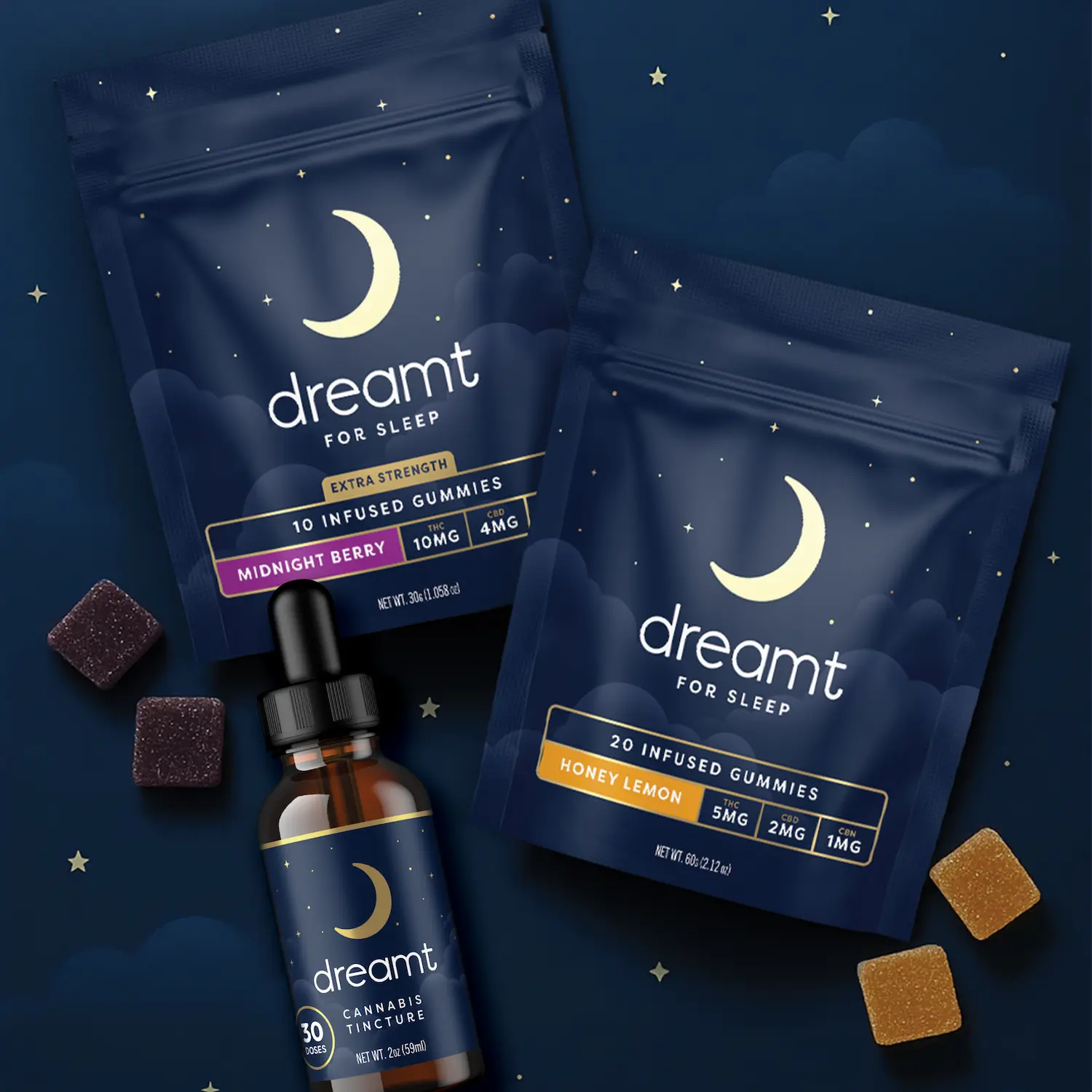 Dreamt for Sleep cannabis products, including two navy blue gummy packages and a tincture bottle. The packaging features a crescent moon design with stars and clouds, labeled flavors Midnight Berry and Honey Lemon.